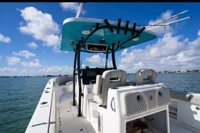  Yacht Photos Pics 2019 Century 3200 Center Console boat on water under blue sky.