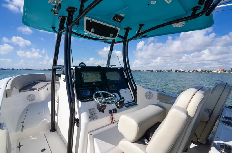 Yacht Photos Pics 2019 Century 3200 Center Console boat interior with dual seats and navigation system on open water.
