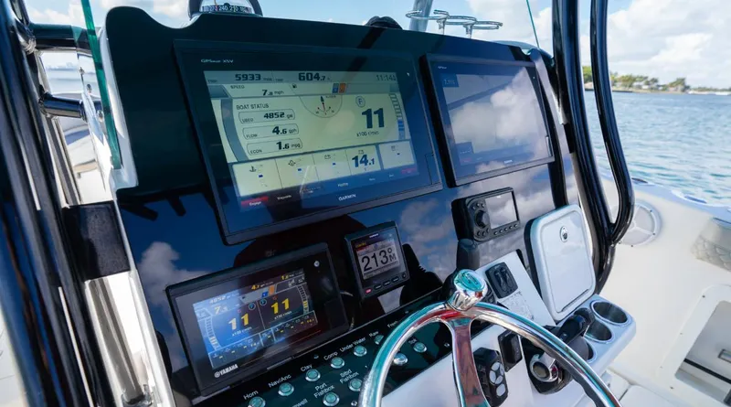  Yacht Photos Pics 2019 Century 3200 Center Console dashboard with navigation screens and controls.