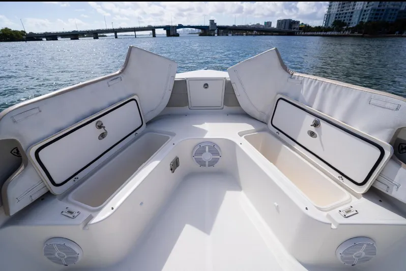  Yacht Photos Pics 2019 Century 3200 Center Console boat with open storage compartments on a sunny day.