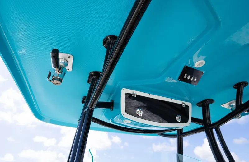  Yacht Photos Pics 2019 Century 3200 Center Console boat's blue overhead console with storage and controls.