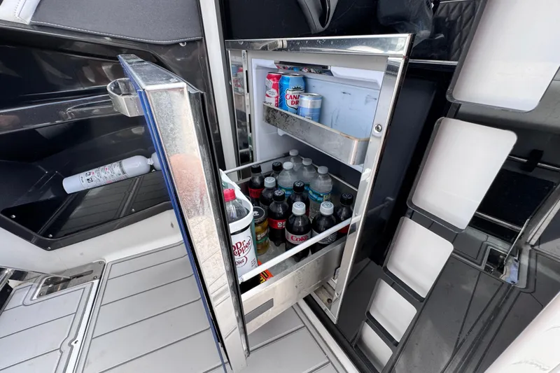 Viroque Yacht Photos Pics Open mini fridge on 2021 Monterey 378 Super Express boat, stocked with drinks.