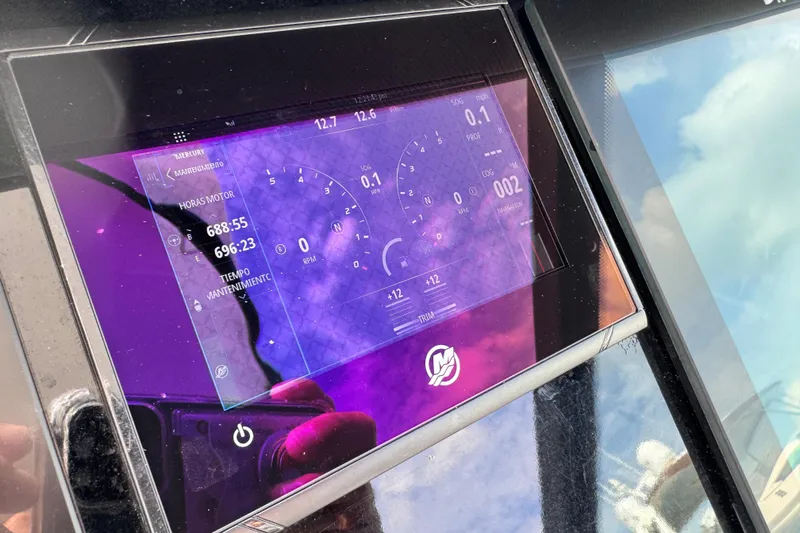 Viroque Yacht Photos Pics Dashboard of 2021 Monterey 378 Super Express displaying engine hours and maintenance data.