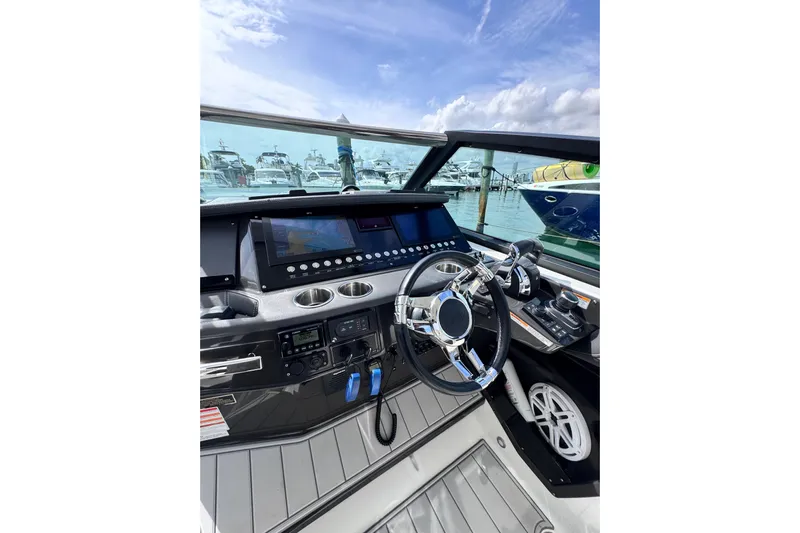Viroque Yacht Photos Pics Cockpit view of 2021 Monterey 378 Super Express boat with modern controls and steering.