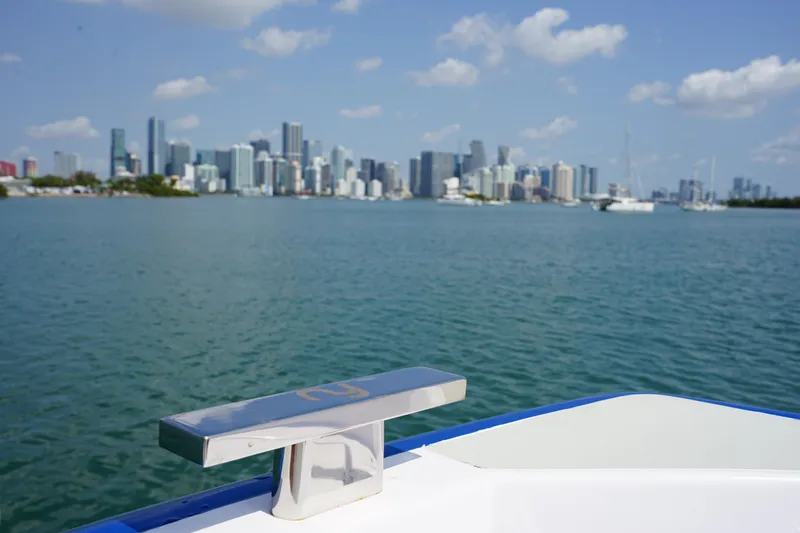  Yacht Photos Pics Nassima Yacht N40 (2025) cruising with city skyline in the background.