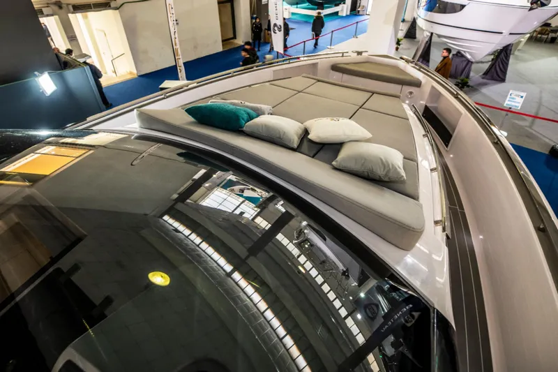  Yacht Photos Pics Nassima Yacht N40 2025 model with luxurious deck seating and cushions at a boat show.