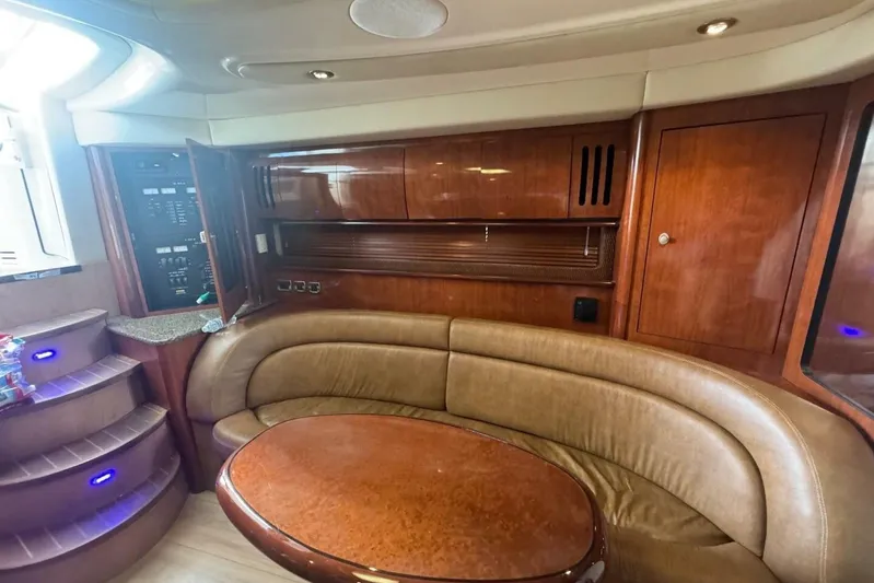 Patry-sea Yacht Photos Pics Luxurious interior of 2005 Sea Ray 420 Sundancer yacht with leather seating and wooden cabinetry.