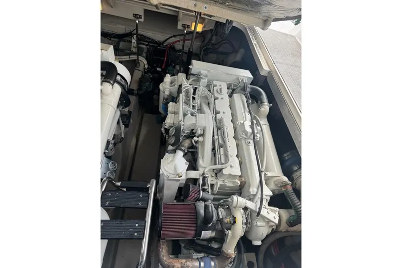 Patry-sea Yacht Photos Pics Engine compartment of a 2005 Sea Ray 420 Sundancer boat, showcasing detailed machinery.