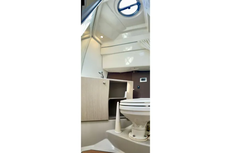  Yacht Photos Pics Interior of 2012 Cranchi Endurance 30 boat bathroom with toilet and cabinet.