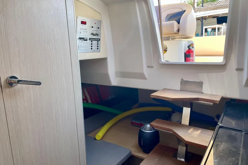  Yacht Photos Pics Interior of 2012 Cranchi Endurance 30 boat with control panel and wooden steps.