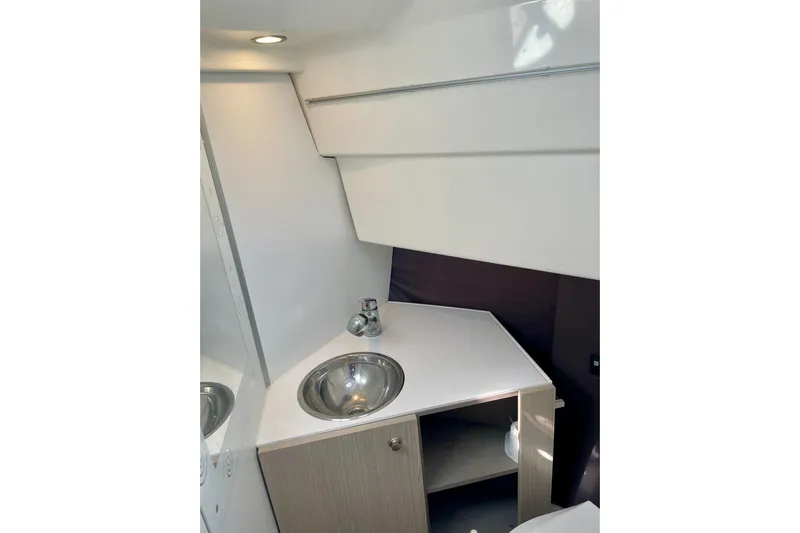  Yacht Photos Pics Interior of 2012 Cranchi Endurance 30 yacht bathroom with sink and cabinet.