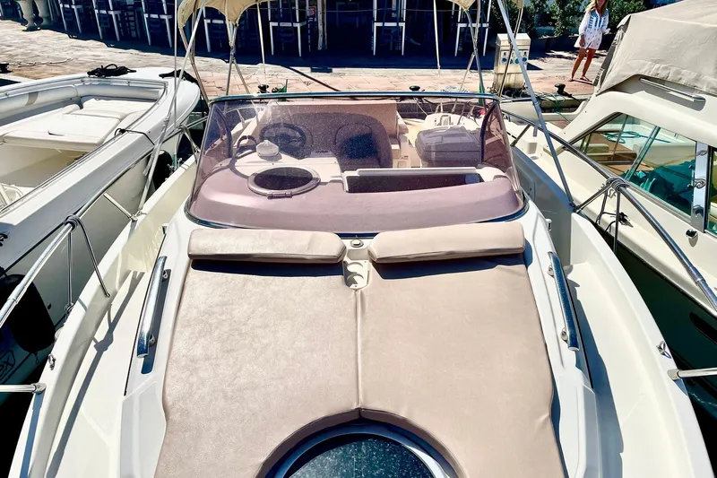  Yacht Photos Pics 2012 Cranchi Endurance 30 boat with sunbathing area and helm, docked at marina.