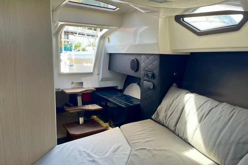  Yacht Photos Pics Interior of 2012 Cranchi Endurance 30 yacht, featuring cozy bed and modern design elements.