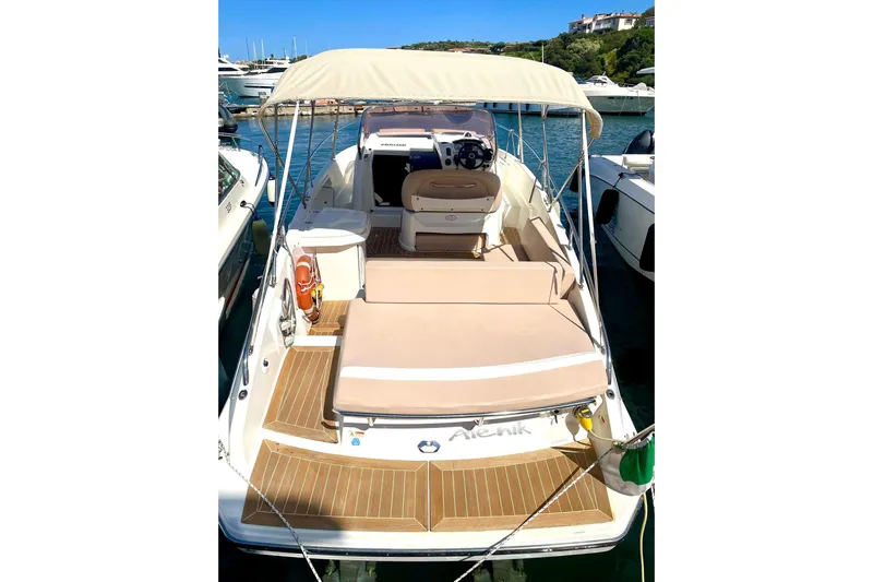  Yacht Photos Pics 2012 Cranchi Endurance 30 boat with canopy, docked in a marina.