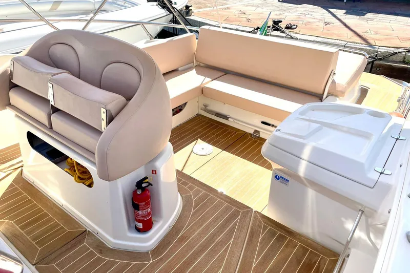  Yacht Photos Pics 2012 Cranchi Endurance 30 boat interior with beige seating and wooden flooring.