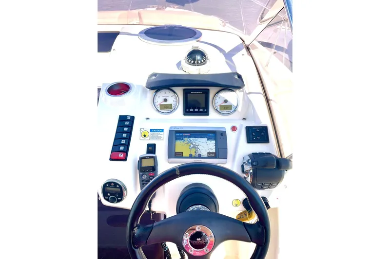  Yacht Photos Pics Cockpit of 2012 Cranchi Endurance 30 with navigation instruments and steering wheel.