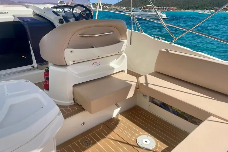  Yacht Photos Pics 2012 Cranchi Endurance 30 boat interior with beige seating and ocean view.