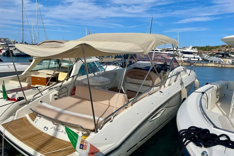  Yacht Photos Pics 2012 Cranchi Endurance 30 yacht docked in a marina under a clear blue sky.