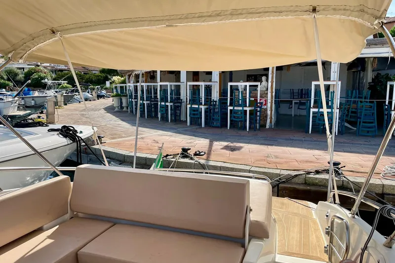  Yacht Photos Pics Cranchi Endurance 30 yacht docked near a waterfront restaurant, 2012 model.