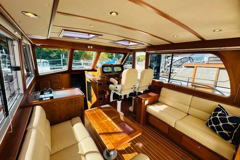 Encore Yacht Photos Pics Luxurious interior of 2017 Sabre 42 Salon Express yacht with plush seating and navigation controls.