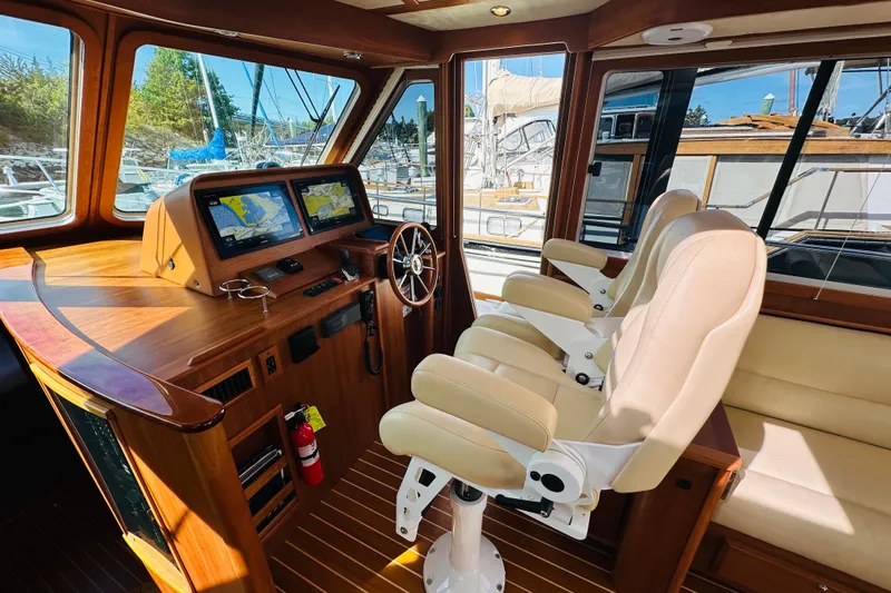 Encore Yacht Photos Pics Luxurious 2017 Sabre 42 Salon Express helm with dual screens and plush seating.
