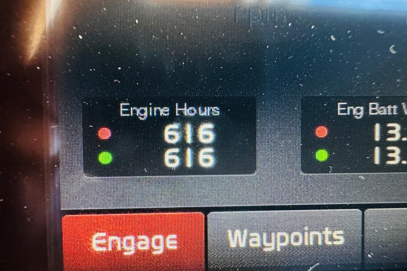 Encore Yacht Photos Pics Display panel showing engine hours and battery voltage on 2017 Sabre 42 Salon Express.