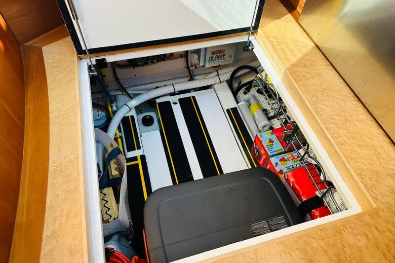 Encore Yacht Photos Pics Storage compartment in 2017 Sabre 42 Salon Express, featuring organized equipment and supplies.