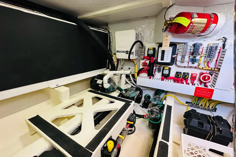 Encore Yacht Photos Pics Engine room of 2017 Sabre 42 Salon Express with electrical panels and fire extinguisher.