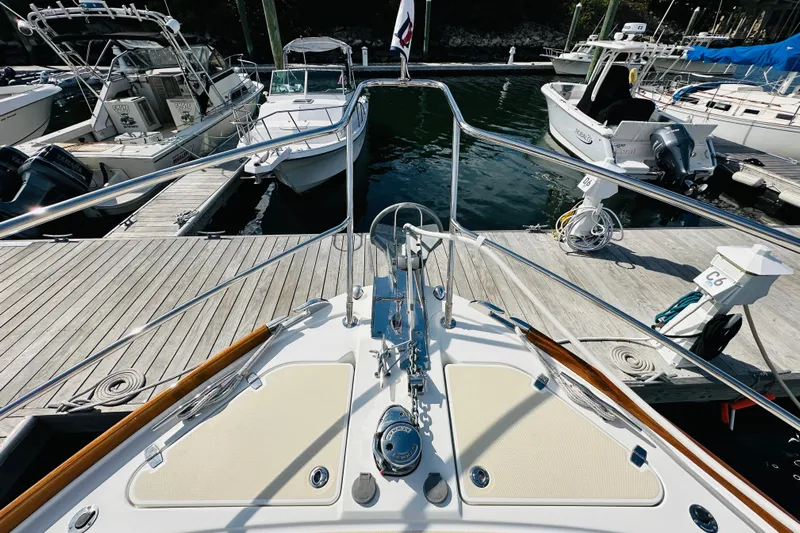 Encore Yacht Photos Pics Bow view of 2017 Sabre 42 Salon Express docked at marina.