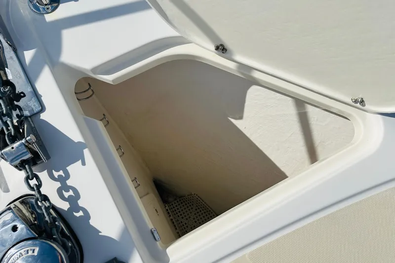 Encore Yacht Photos Pics Anchor locker of 2017 Sabre 42 Salon Express yacht, open with visible chain.
