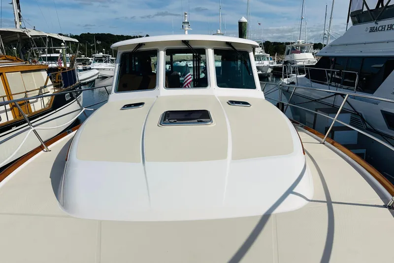 Encore Yacht Photos Pics 2017 Sabre 42 Salon Express yacht docked at marina, showcasing sleek design and spacious deck.