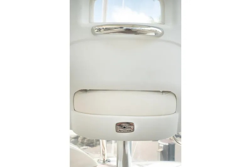 No. 7 Yacht Photos Pics 2018 Riviera 43 Open Flybridge interior detail with chrome accents and Pompanette branding.