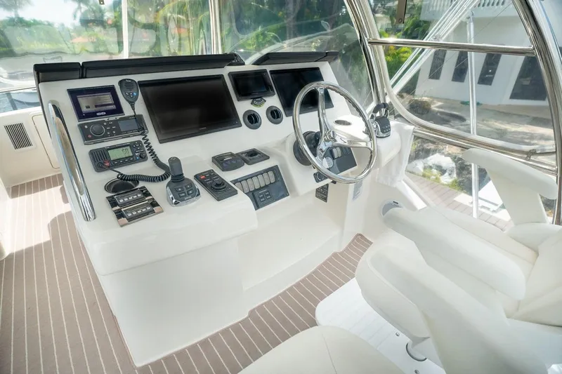 No. 7 Yacht Photos Pics Helm of 2018 Riviera 43 Open Flybridge with advanced navigation controls and steering wheel.