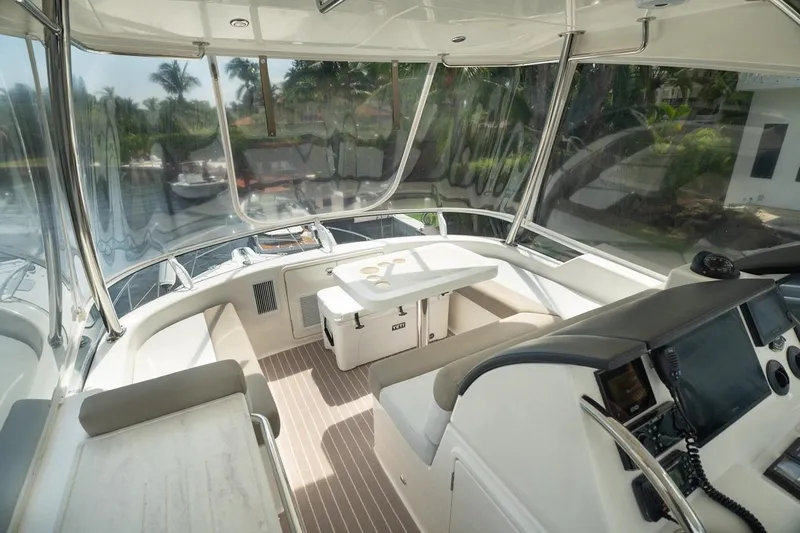 No. 7 Yacht Photos Pics 2018 Riviera 43 Open Flybridge interior with helm, seating, and navigation equipment.