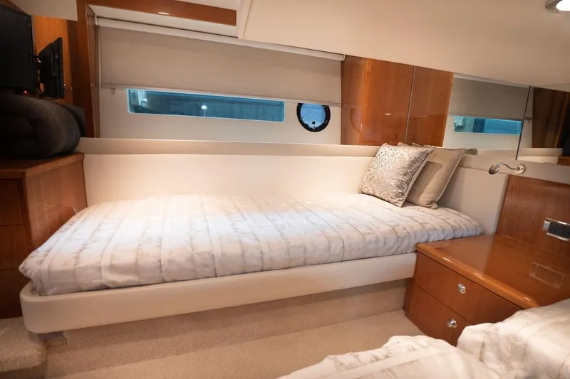 No. 7 Yacht Photos Pics Luxurious cabin interior of 2018 Riviera 43 Open Flybridge yacht with cozy bedding.