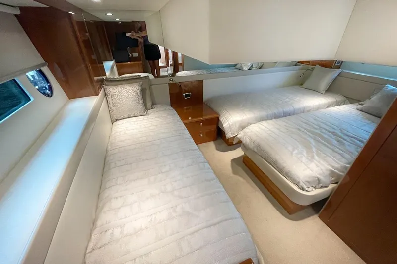 No. 7 Yacht Photos Pics Luxurious interior of 2018 Riviera 43 Open Flybridge with twin beds and elegant decor.