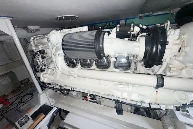 Slab Daddy Yacht Photos Pics Engine room of a 2000 Viking 50 Convertible yacht, showcasing detailed machinery.