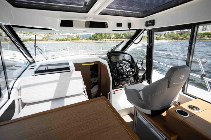  Yacht Photos Pics Interior of 2022 Jeanneau NC Weekender 895 boat with modern helm and seating.