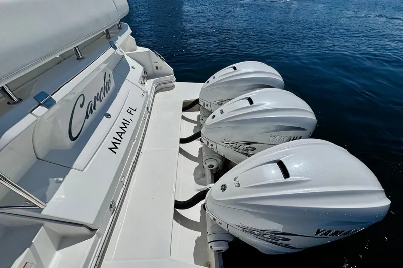 Carchi Yacht Photos Pics 2022 Regal 42 XO boat with triple Yamaha outboard engines, docked in Miami, FL.