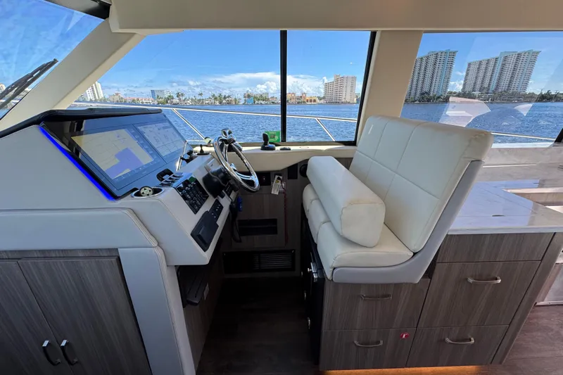 Carchi Yacht Photos Pics Interior helm of 2022 Regal 42 XO yacht with modern navigation system.