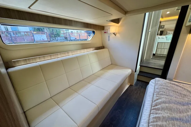 Carchi Yacht Photos Pics Luxurious interior of 2022 Regal 42 XO yacht with modern seating and elegant design.