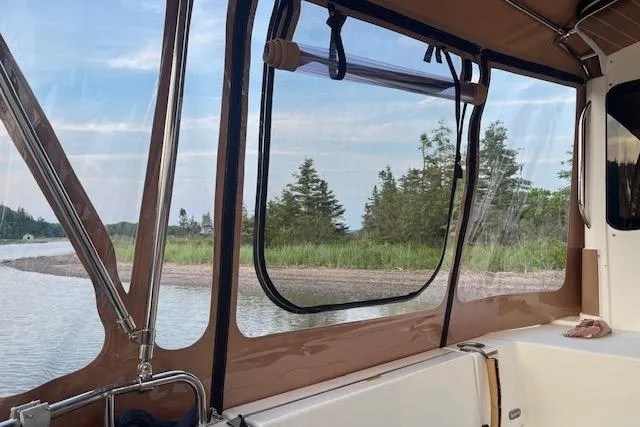 Mystic Yacht Photos Pics 2014 Ranger Tugs R-31 interior view with scenic water and trees outside.