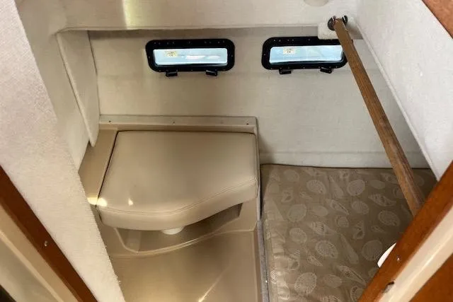 Mystic Yacht Photos Pics 2014 Ranger Tugs R-31 interior cabin with compact toilet and small bed.