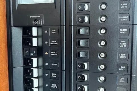 Mystic Yacht Photos Pics Control panel of a 2014 Ranger Tugs R-31 boat, featuring various switches and indicators.