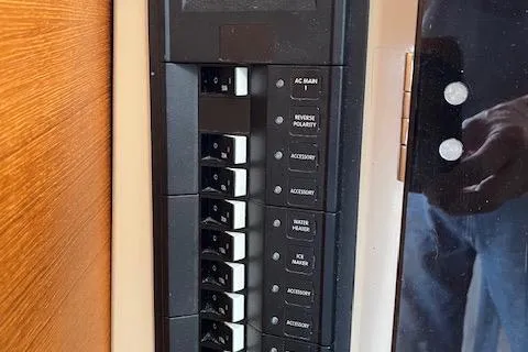 Mystic Yacht Photos Pics Control panel of a 2014 Ranger Tugs R-31 boat with labeled switches.