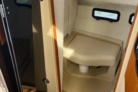 Mystic Yacht Photos Pics 2014 Ranger Tugs R-31 interior cabin with beige seating and small windows.