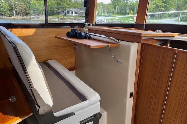 Mystic Yacht Photos Pics Interior of 2014 Ranger Tugs R-31 boat with seating and foldable table.