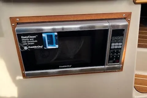 Mystic Yacht Photos Pics Built-in microwave on 2014 Ranger Tugs R-31 boat, featuring EasyClean technology.