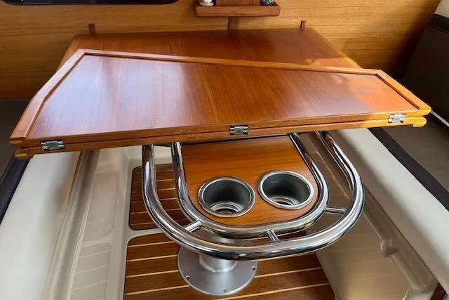 Mystic Yacht Photos Pics 2014 Ranger Tugs R-31 interior with wooden table and cup holders.
