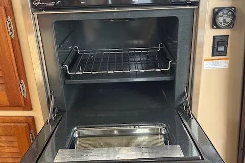 Mystic Yacht Photos Pics Open oven inside a 2014 Ranger Tugs R-31 boat kitchen area.